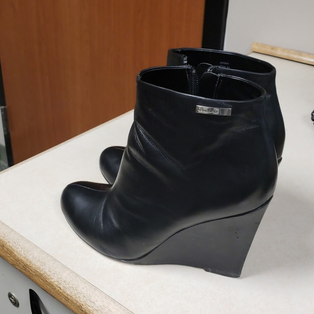 Black Calvin Klein wedged booties